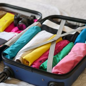 Suitcase with clothes neatly folded inside