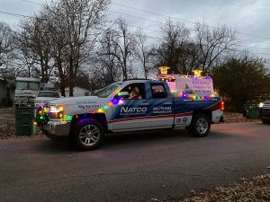 NATCO truck covered in colorful Christmas lights for the Bull Shoals Christmas parade.